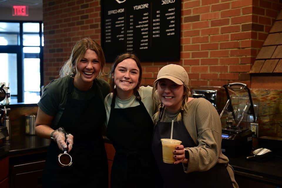 Three girls working at Rinnova, campus coffee shop